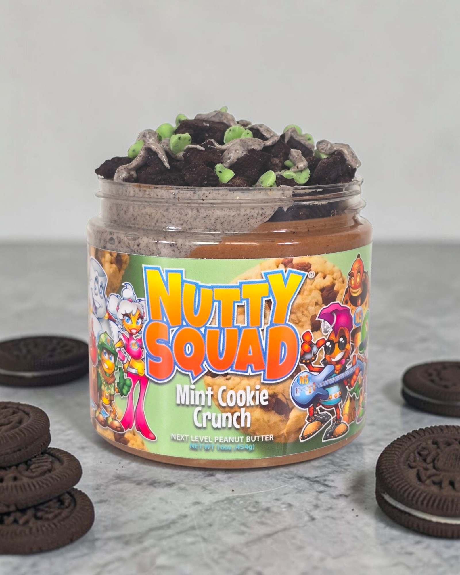 Jar of 'Nutty Squad' mint cookie crunch with Oreo cookies on a gray surface